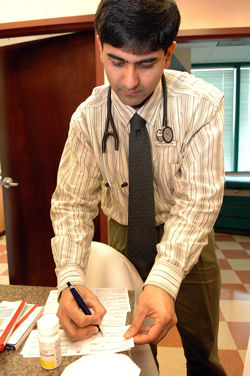 Tareq Abedin ACP Member an internist in Ashburn Va checks prescriptions and must sign the labels before they can be dispensed That is the last part of the process before the patient receives the