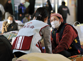 An evacuee right is checked by a doctor at a shelter in Rikuzentakata Iwate Prefecture northeastern Japan one week after a massive earthquake and resulting tsunami Photo by AP PhotoslashKyodo News