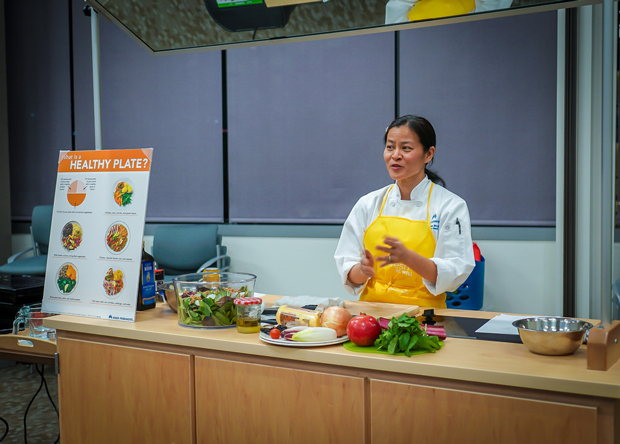 At Kaiser Permanentes Thrive Kitchen Linda Shiue MD teaches patients and physicians that the ideal plate is compared of 25percent healthy protein 25percent whole-grain carbohydrates and 50percent vegetables Phot