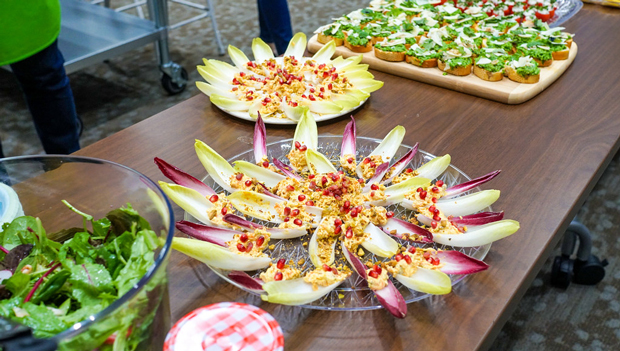 The menu at Kaiser Permanentes Thrive Kitchen emphasizes whole foods At center endive leaves are sitting pretty topped with harissa carrot yogurt pistachios and pomegranate arils Photo courtesy