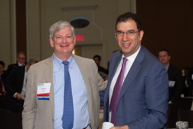 At left Robert B Doherty Senior Vice President for Governmental Affairs and Public Policy for ACP congratulates Andrew M Slavitt MBA former acting administrator of CMS who received the College