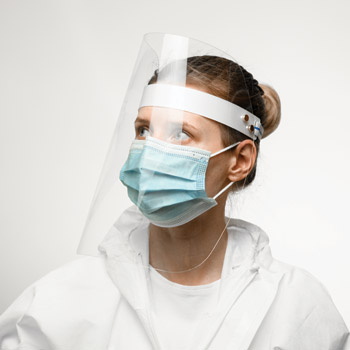 Reduction in facial touching and protection from droplets may help reduce self-contamination risk among clinicians wearing a mask or respirator under a face shield Image by MaximFesenko
